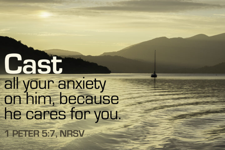 Sunset over a calm lake with silhouetted hills and a lone sailboat, overlaid by the verse: "Cast all your anxiety on him, because he cares for you."